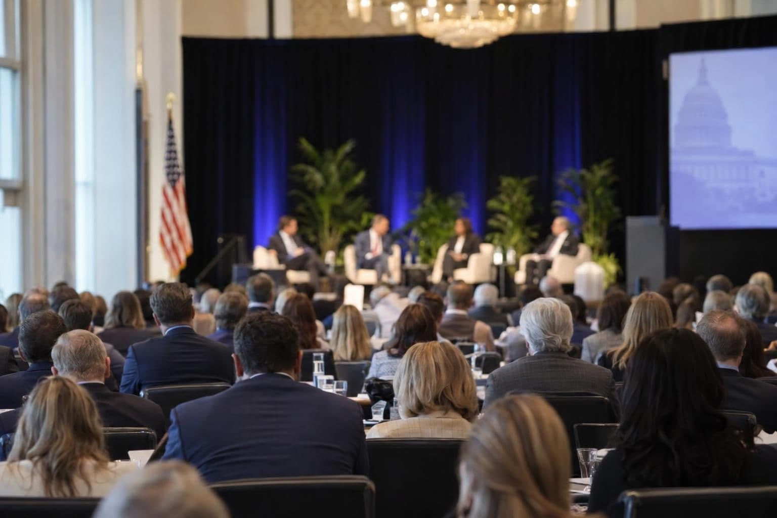 A seated panel addresses attendees at a health-policy summit in Washington.