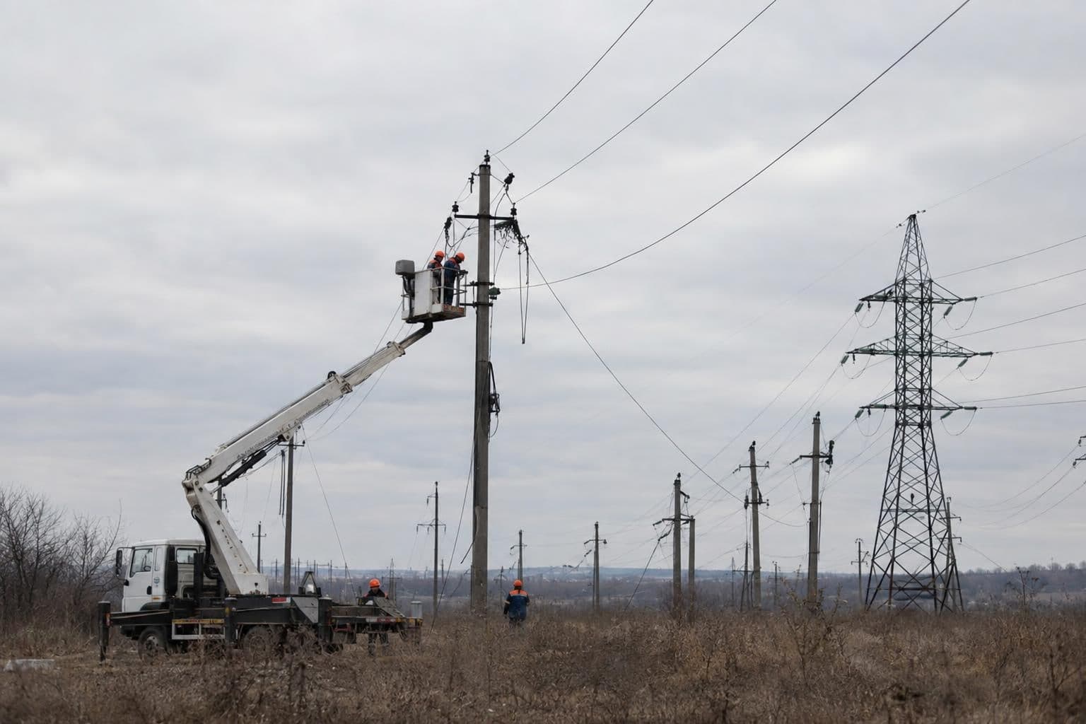 Utility crews repair electricity infrastructure after strikes caused outages in parts of Ukraine.