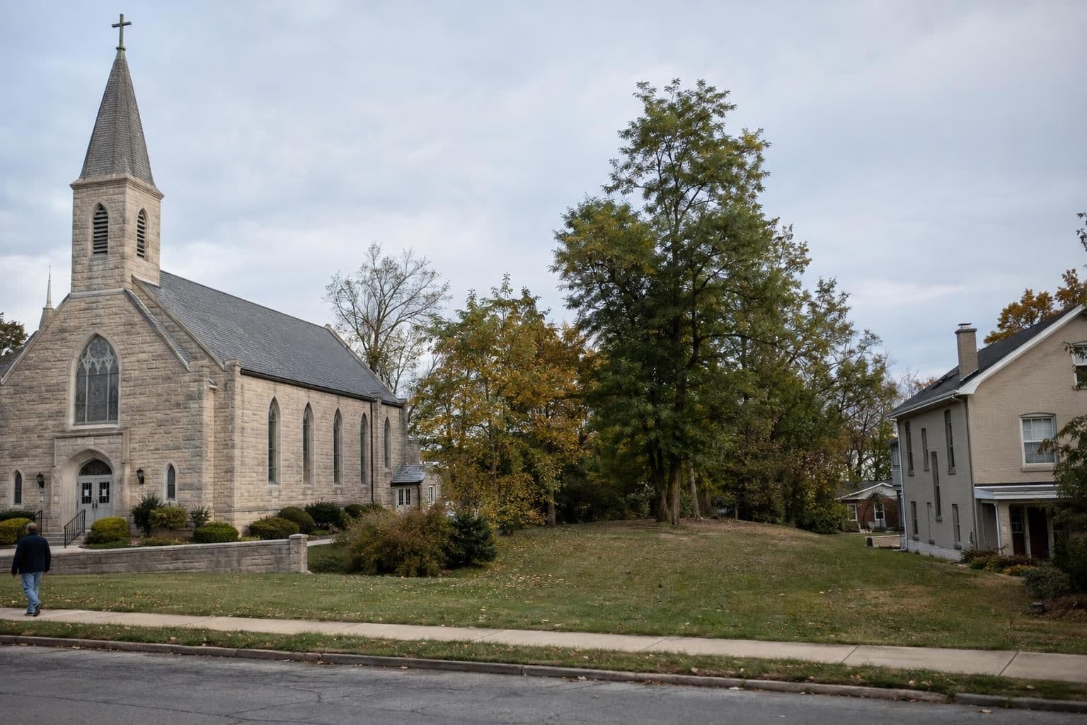 A church stands beside a residential parcel proposed for an outdoor grotto.