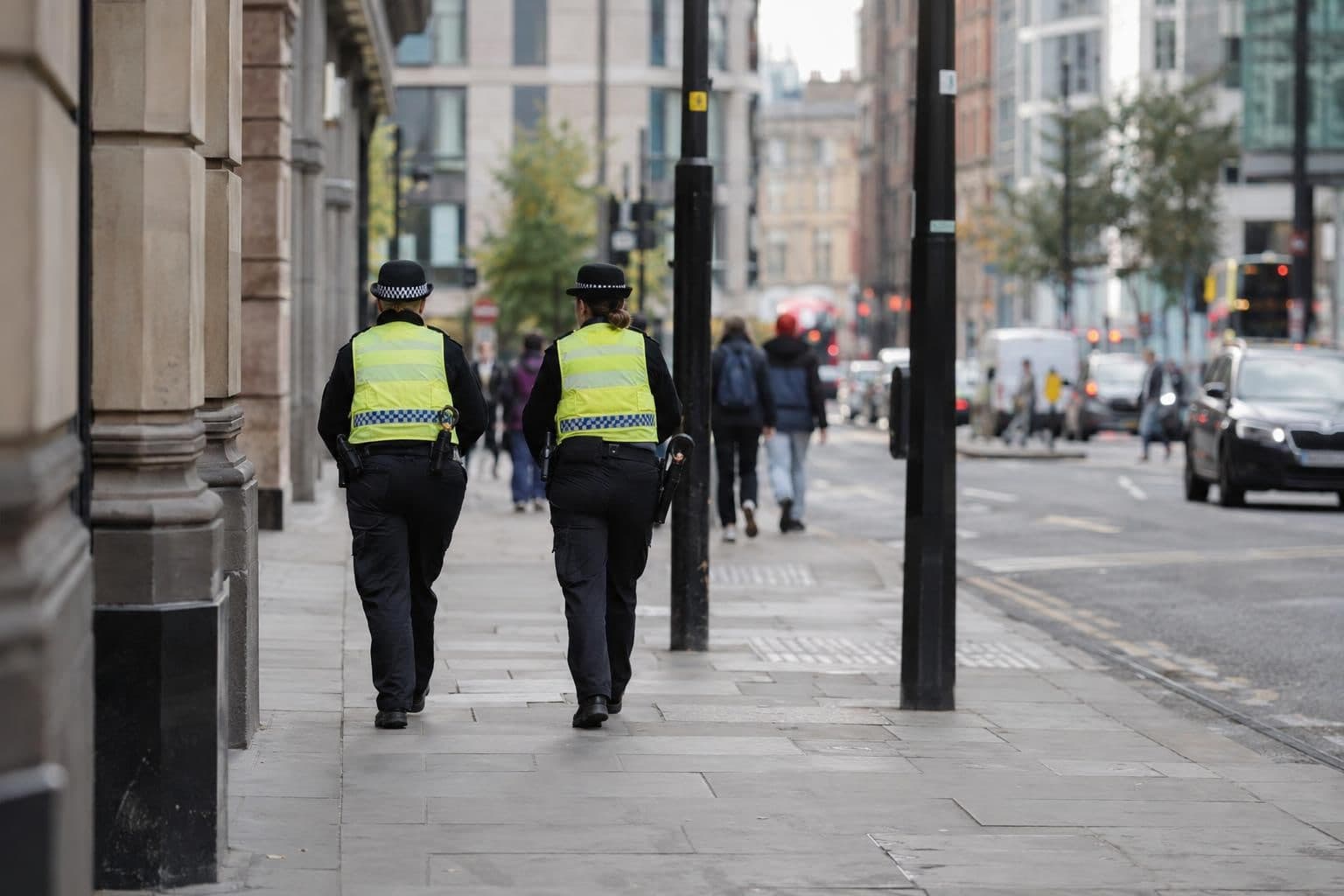 Police officers on a Manchester street in a generic illustration of a counterterrorism investigation.