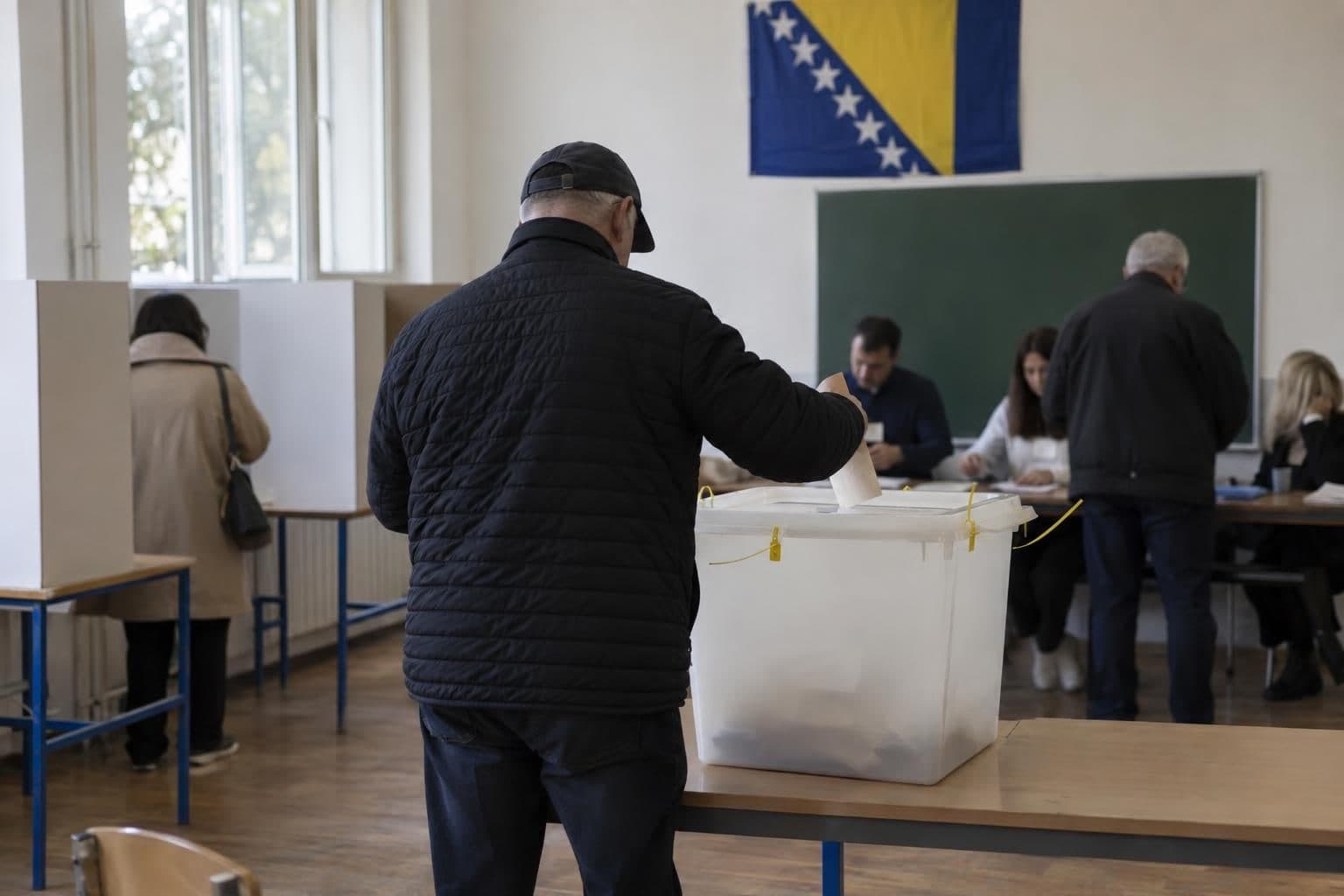 A voter casts a ballot at a polling station during Bosnia and Herzegovina’s election.