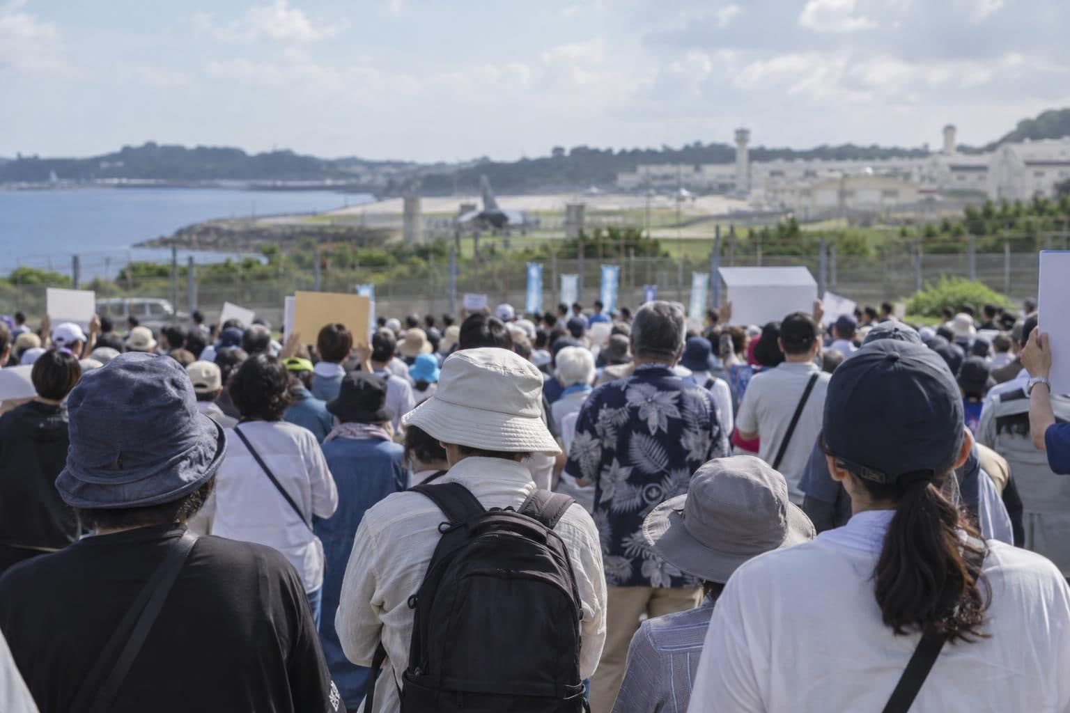 Residents gather at an Okinawa rally over a killing case and safety concerns tied to U.S. military bases.