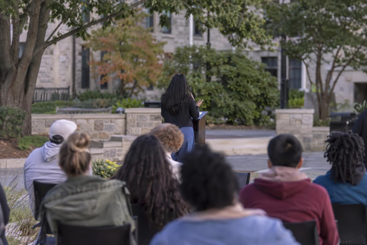 A speaker addresses attendees at a campus event.