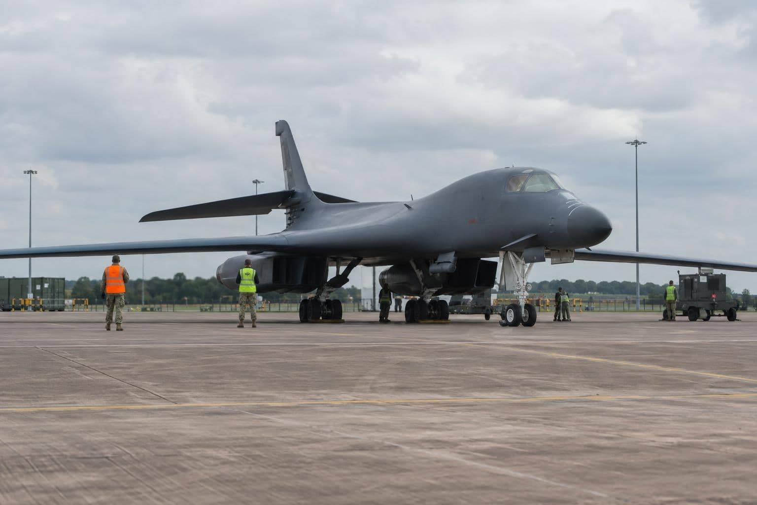 A U.S. bomber at an airfield illustrates the withdrawal discussed in the article.