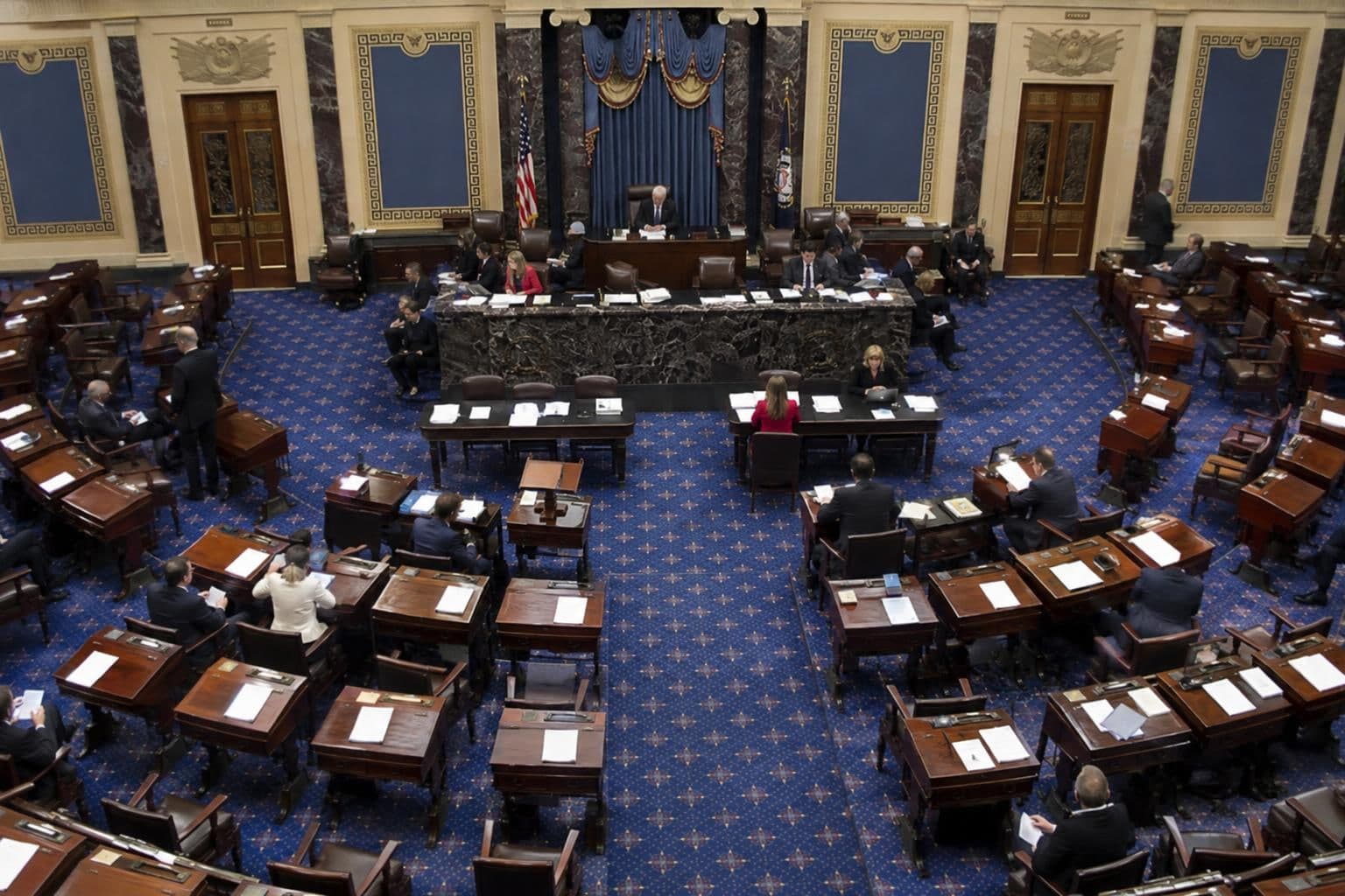 Senators sit at their desks in the U.S. Senate chamber during a floor session.