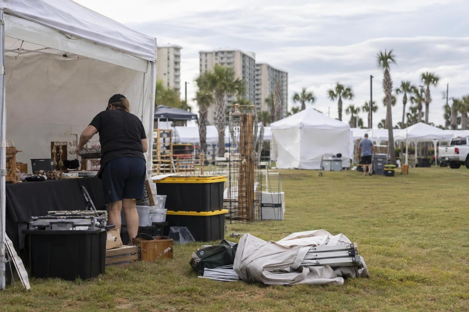An anonymous vendor packs up a booth after the Gulf Shores festival was canceled.