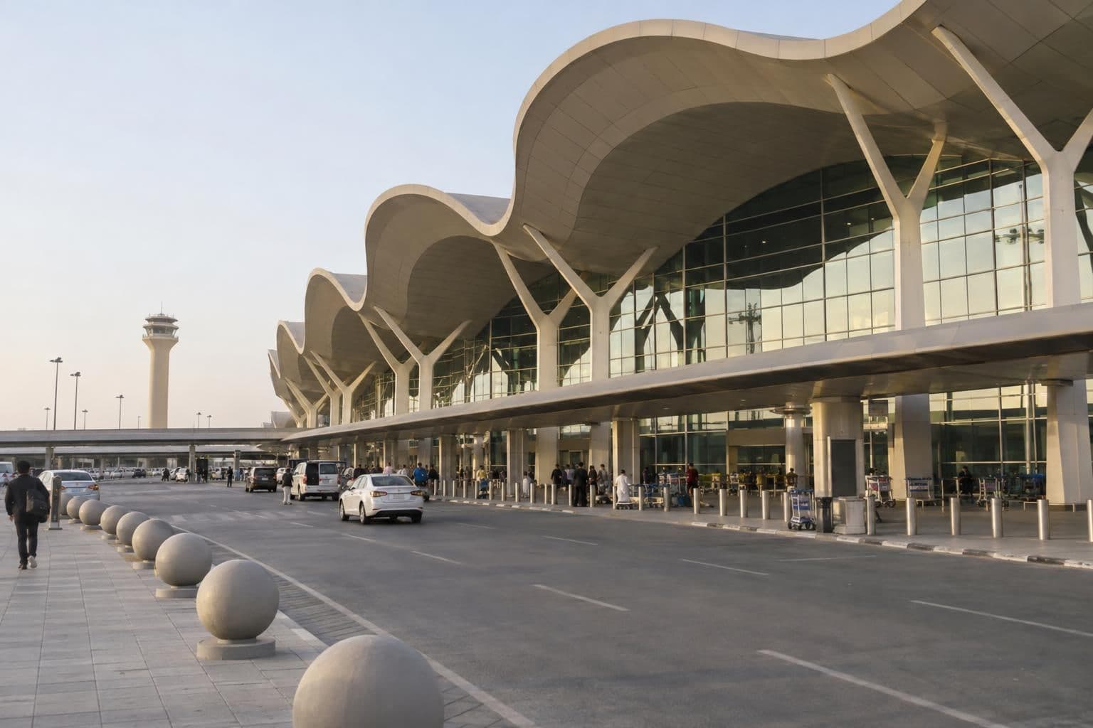 A passenger terminal at an international airport, seen from outside.