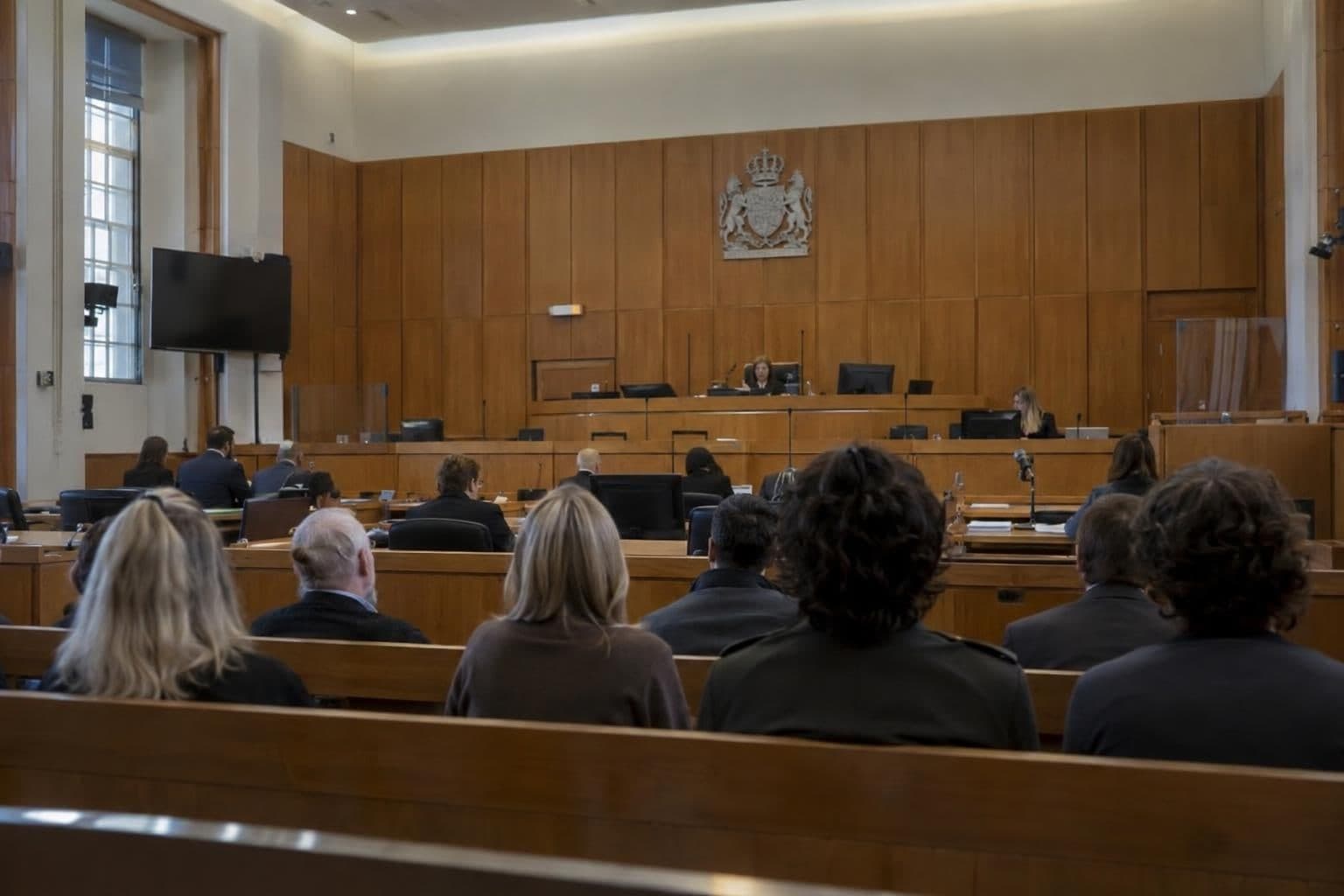 Prospective jurors are questioned at Southwark Crown Court in London.