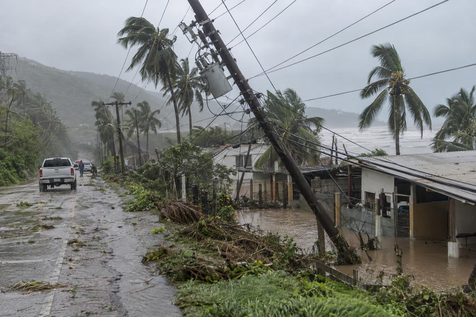 Flooded road and toppled trees on Mexico's Pacific coast as Hurricane Simon's rain bands pass offshore.