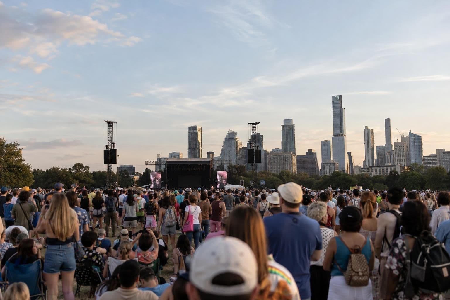 A distant crowd at a public event in Austin, with no individual identifiable.